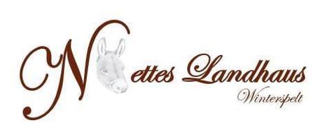 An elegant logo for "Nice Country House" featuring a stylized horse head. It conveys a rural and inviting charm.