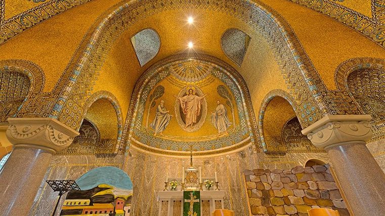 Magnificent mosaics and artistic decorations in the Church of the Redeemer Gerolstein, with a central altar and vaulted ceiling.