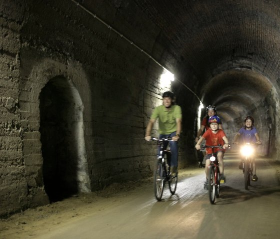 The tunnel passage near Bleialf makes it clear: the Eifel-Ardennes Cycle Route was originally a railroad line, © Eifel Tourismus GmbH/intention